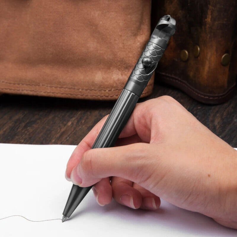 EDC Titanium Alloy Tactical Pen with a refill while writing