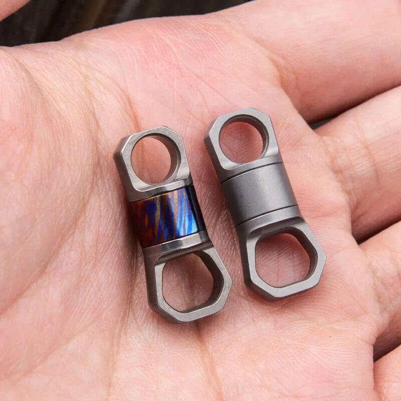 Titanium 360° Rotating Key Ring Clip in a hand
