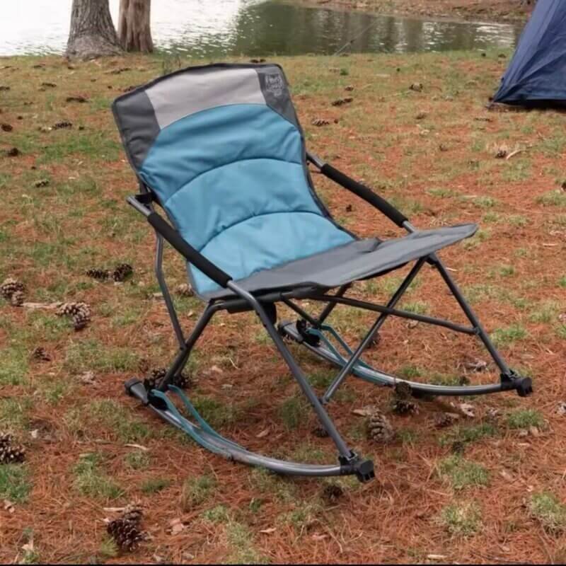 A Heavy-duty Lightweight Foldable Rocking Camping Chair placed outdoors on a grassy lawn