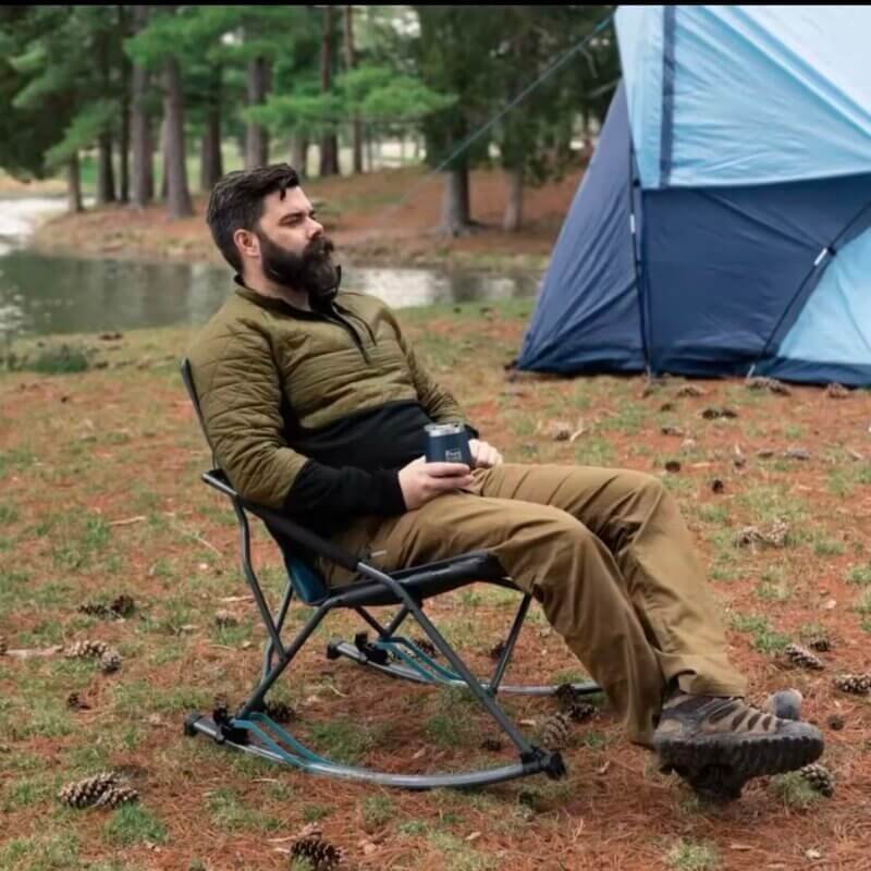 A guy sitting in a Foldable Rocking Camping Chair