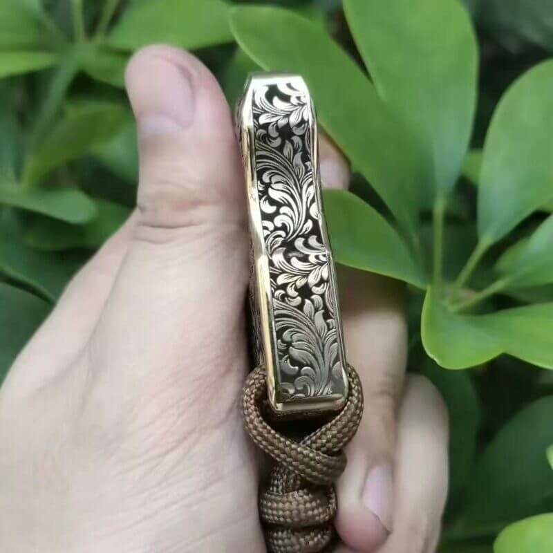 Side View 2 of Finely carved brass knuckles self defense with Constantine-inspired Motif