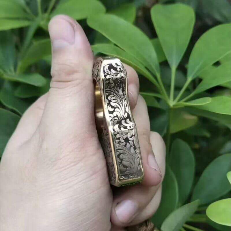 Side View of Finely carved brass knuckles self defense with Constantine-inspired Motif