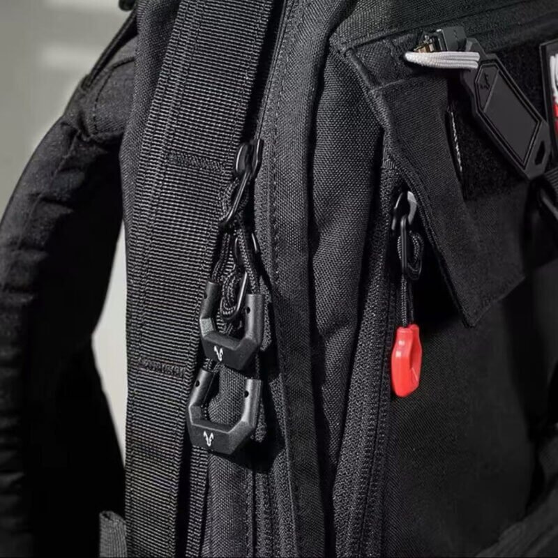 Different Shapes of zipper pull replacements attached to a backpack zipper