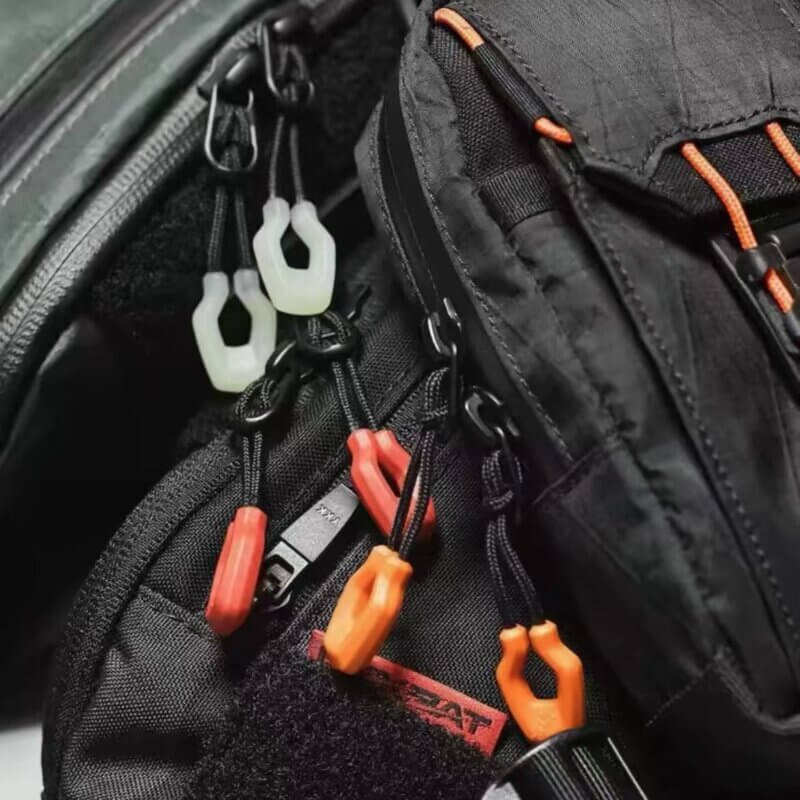 zipper pull replacements attached to a backpack zipper